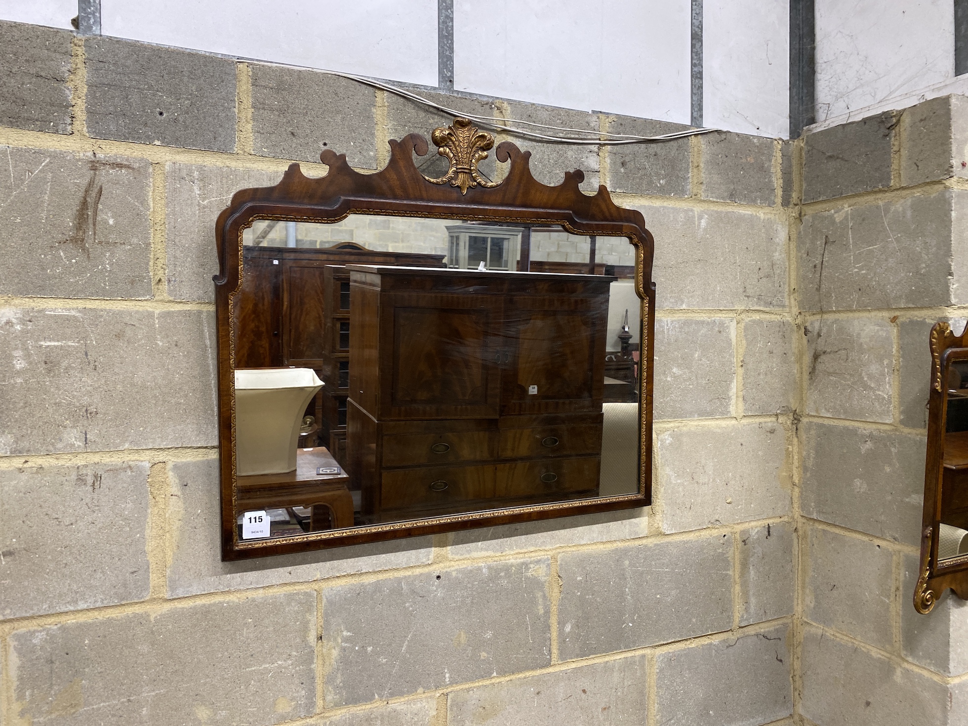 A Queen Anne style parcel gilt fret cut wall mirror, with gilt fleur de lys surmount, together with another, larger mirror width 82cm, height 71cm